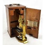 LEITZ VETZLER; a brass monocular microscope, serial number 34659, with three lenses, three slides
