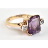 A yellow metal amethyst and white sapphire ring, the inner band stamped 14c, approx 4.4g, size L.