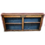 A Regency rosewood open fronted bookcase, with brass inlaid panels, raised on plinth base, length