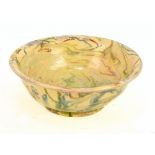 A late 18th/early 19th century agate ware bowl with simple foot, diameter 24cm.Additional