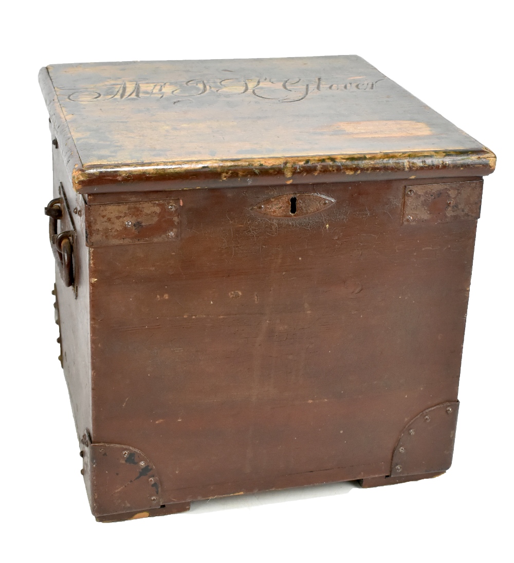 A 19th century stained pine twin handled travelling chest with iron mounts and twin handles,