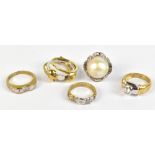 Four 9ct yellow gold dress rings, three set with white coloured stones, and a further dress ring