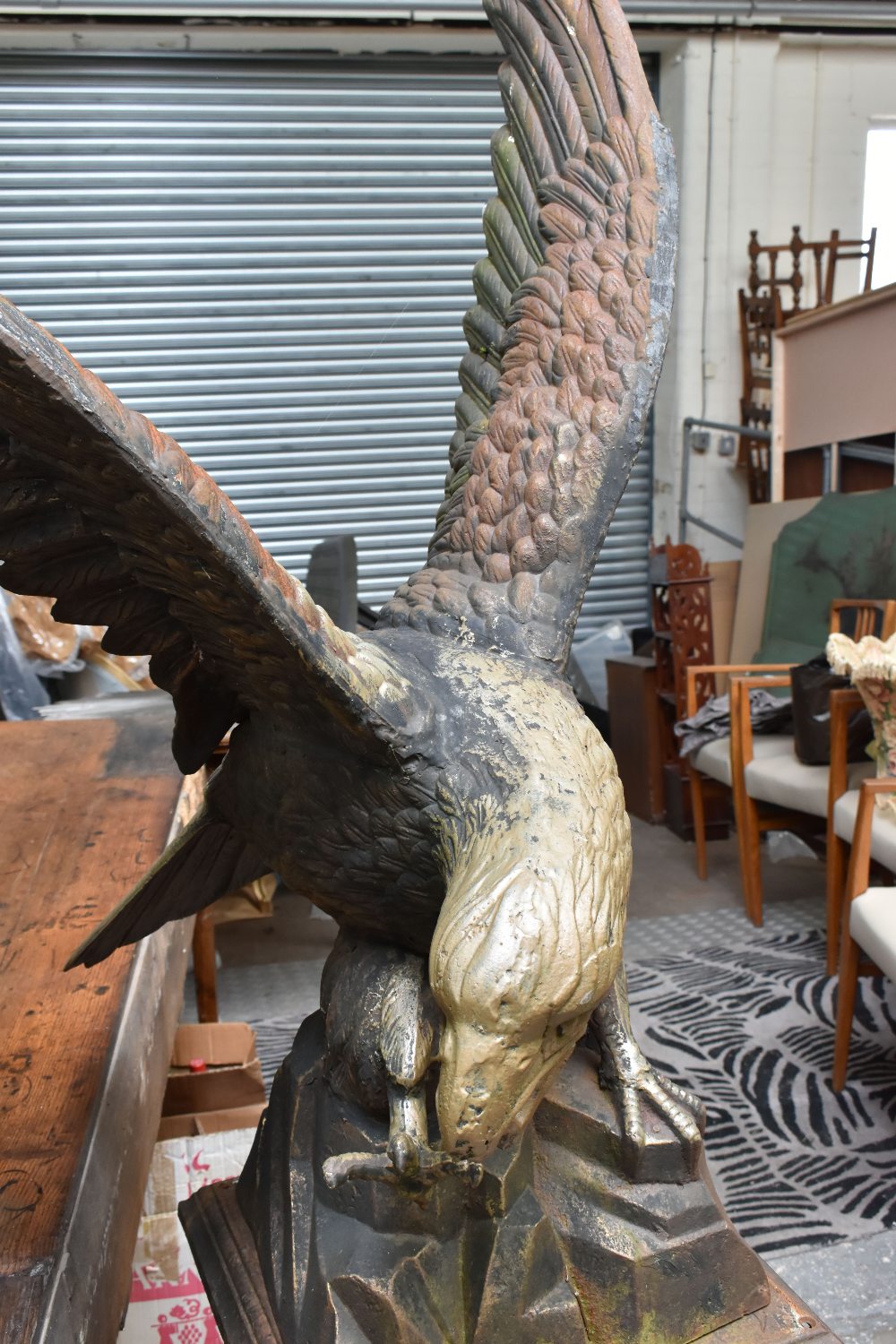 A reproduction painted cast iron model of an eagle perching on a rocky setting, raised on matched - Image 3 of 3