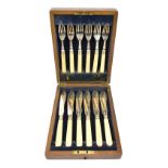 B WORTH & SONS; a cased George V hallmarked silver fish set comprising six knives and forks with