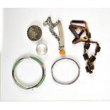 A small mixed group of costume jewellery including silver ID bracelet, hinged bangle, bead necklace,