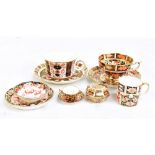 ROYAL CROWN DERBY; ten items of Imari decorated tableware including two tea cups, miniature