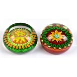 PERTHSHIRE; two circular glass paperweights to include and sunflower example, signed and dated