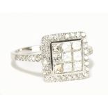 An 18ct white gold diamond step cluster ring totalling approx 1.75cts and with nine main stones,