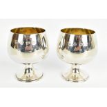 A pair of Elizabeth II hallmarked silver brandy goblets with gilt washed interiors, Birmingham 1973,