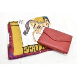 CHLOE; a red leather purse with pebbled leather texture with a printed logo to the front, 14 x 10