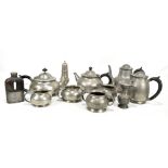 LIBERTY & CO; an English Pewter five piece tea set, a Tudric pewter three piece set, a pewter jug, a