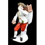 MEISSEN; a mid-18th century figure of a peasant snuff taker, modelled by Kaendler circa 1740,