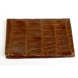 A brown vintage leather crocodile skin wallet lined with brown Napa leather, 10 x 17cm.