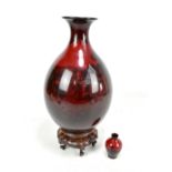 ROYAL DOULTON; a flambe baluster vase with flared rim, printed marks to base, height 36cm, with
