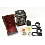 ZEISS; an Ikoflex F3.5 Triotar in leather case, a right angle finder, close up attachment for nos.