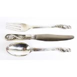 GEORG JENSEN; a Danish sterling silver 'Blossom' pattern knife, fork, and spoon set, all bearing