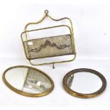 A small George III oval wall mirror, length 32cm, a further oval wall mirror, length 25.5cm, and