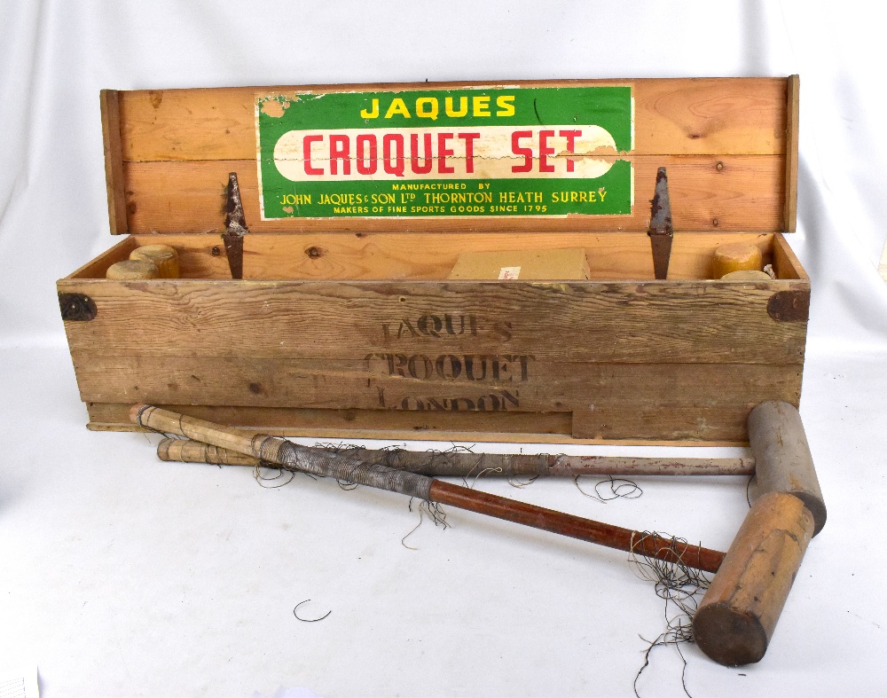 JAQUES; a vintage boxed croquet set with two additional distressed mallets.