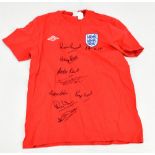 ENGLAND; an Umbro replica 1966 cotton home shirt, signed by Peters, Bobby Charlton, Stiles, Banks,