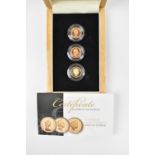 A cased set of three half sovereigns, 'The Faces of Queen Elizabeth II', all proof, encapsulated and