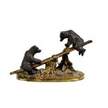 A good 19th century bronze and ormolu desk clip modelled as two bears upon a seesaw, with red