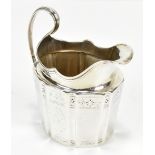 **AMENDED DESCRIPTION** An 18th century hallmarked silver cream jug, with panelled decoration and