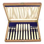 GW SHIRTCLIFFE & SON; a cased George VI hallmarked silver fish set, comprising six knives and forks,