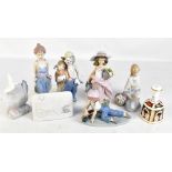 LLADRO; five figures including 'All Aboard', two Lladro advertising plaques and a Royal Crown