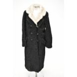 FUR COAT: a 1950s full length Astrakhan/Persian lamb coat with cream fur collar, size medium/large.