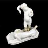 A 19th century Italian blanc de chine glazed figure group of putto holding grapes beside a recumbent