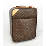 LOUIS VUITTON; a Pegase Cloth cabin sized suitcase, with brown monogram coated cloth, and nude