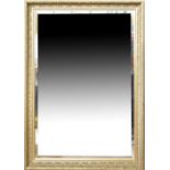 A gilt heightened wall mirror with bevelled plate.Additional Information71cm x 100cm.