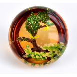 WILLIAM MANSON; a limited edition paperweight encased with tree in landscape setting, signed to