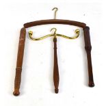 An early 19th century mahogany and gilt brass robe hanger, a coat hanger, a tip staff and