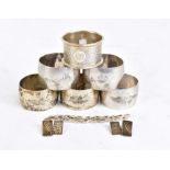 A collection of hallmarked silver and white metal including a napkin ring with engine turned detail,