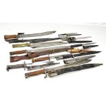 A group of German and other bayonets including WK&C examples (one sawback) and a Simson example (two