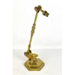 DUGDILL PATENT; a 19th century brass adjustable desk lamp, raised on hexagonal base, height 35cm.