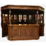 A large and impressive bar with triangular sectioned canopy above eight bevelled mirrors flanked