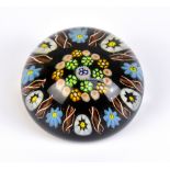 PAUL Y'SART; an early paperweight, with internal Millefiori and scrolling decoration, pontil mark to
