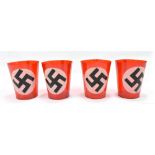 A set of four German Third Reich celluloid table candle holders featuring swastikas (4).