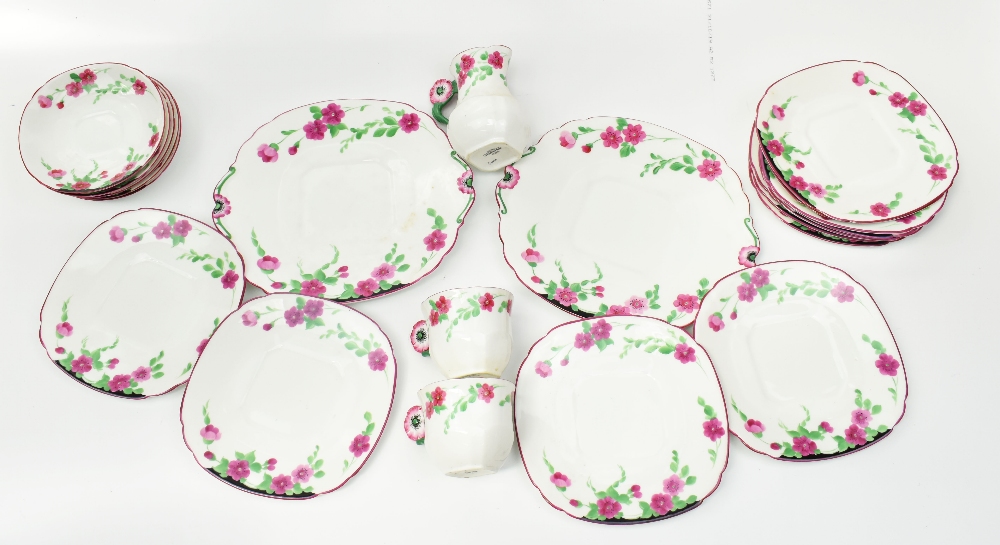 ADDERLEY WARE; a floral hand painted part tea service, the tea cups with floral moulded handles,