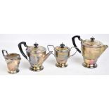 BIRMINGHAM PLATE & CUTLERY LTD; a George VI hallmarked silver four piece tea service with hammered