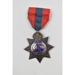 A George V British Imperial Service Medal (Star-type) awarded to Herman A. Broad, the ribbon clasp