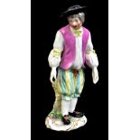 MEISSEN; a mid-18th century figure of a young gentleman wearing black hat, painted letter C to base,