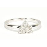 An 18ct white gold ten stone diamond ring with triangular shaped platform, size N, approx 3g.