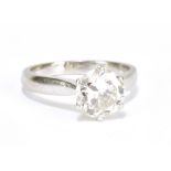A platinum and diamond solitaire ring with round brilliant cut stone weighing approx 1.68cts, colour