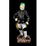 MEISSEN; a mid-19th century figure of a miner, painted marks to base, incised 1309 and painted
