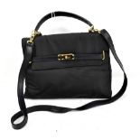 COSCI, ITALY; a navy blue cloth and leather hand/shoulder bag with gold hardware.