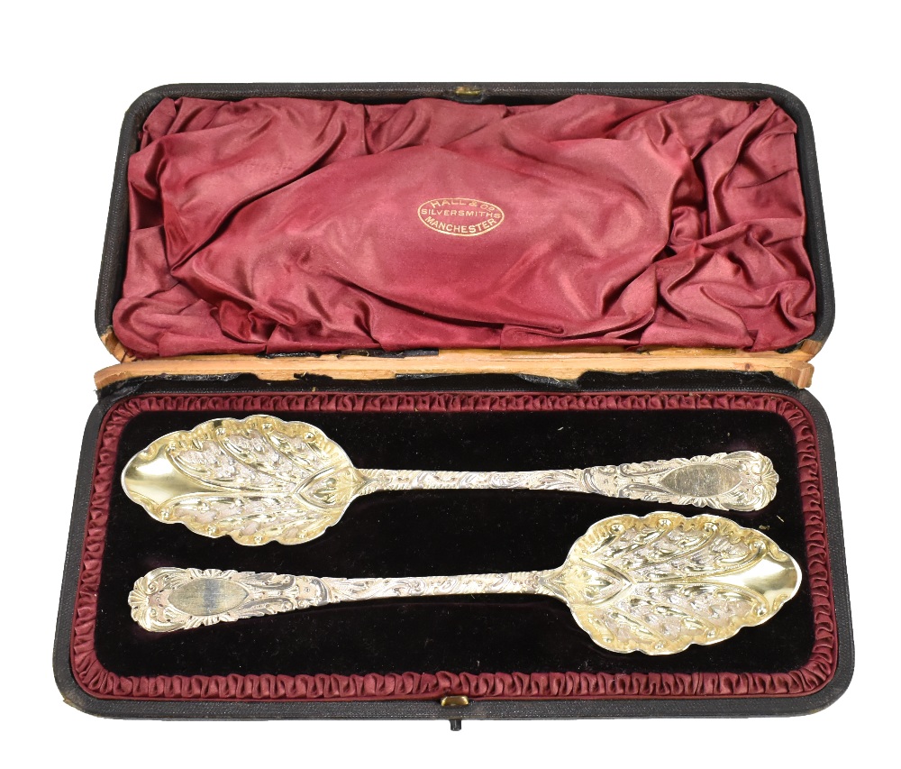 WILLIAM RAWLINGS SOBY; a pair of William IV hallmarked silver berry spoons with repoussé foliate