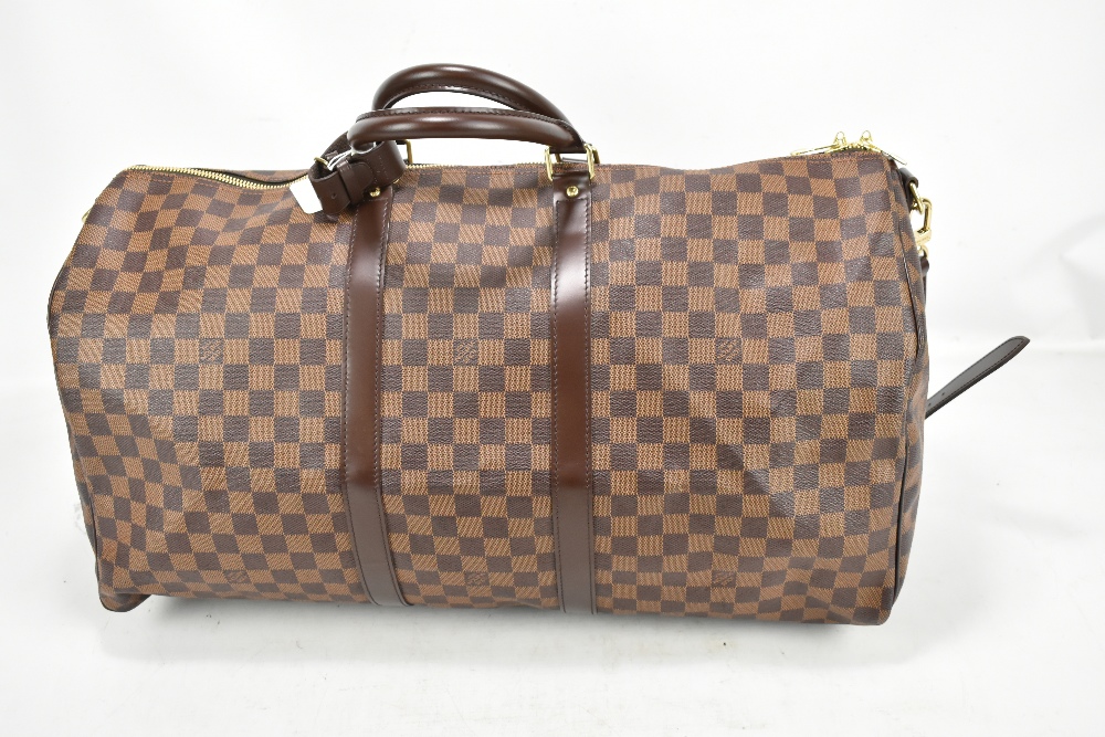 LOUIS VUITTON; a Keepall Bandouliere 55 Monogram macassar Boston bag, with brown leather straps - Image 2 of 9